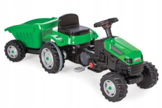 Pedálový traktor so zeleným umelcom príves